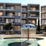 Sovereign Estates   Modern apartment complex with balconies surrounding a circular pool and a mushroom shaped fountain in the foreground 2026 Modern apartment complex with balconies surrounding a circular pool and a mushroom shaped fountain in the foreground