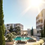 09 Pool Hero View-min - Sovereign Estates Sovereign Estates Modern apartment complex with a central rectangular pool surrounding lounge chairs and a glass wrapped community pavilion under a bright sky 2026 Modern apartment complex with a central rectangular pool surrounding lounge chairs and a glass wrapped community pavilion under a bright sky