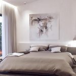 3-Lana-Villa-5-Main-Bedroomjpg - Sovereign Estates Sovereign Estates Bedroom with a low gray bed white walls and abstract art above the headboard sliding glass door to a balcony on the left 2026 Bedroom with a low gray bed white walls and abstract art above the headboard sliding glass door to a balcony on the left
