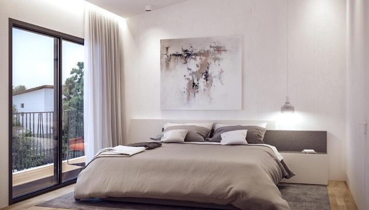 3-Lana-Villa-5-Main-Bedroomjpg - Sovereign Estates Sovereign Estates Bedroom with a low gray bed white walls and abstract art above the headboard sliding glass door to a balcony on the left 2026 Bedroom with a low gray bed white walls and abstract art above the headboard sliding glass door to a balcony on the left