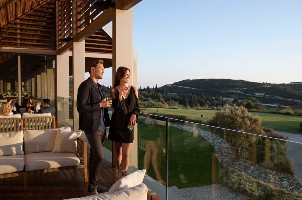 CClubhouse-restaurant-terrace-1024x680jpg - Sovereign Estates Sovereign Estates Couple in evening attire with drinks on a glass railed terrace overlooking a green landscape at sunset 2026 Couple in evening attire with drinks on a glass railed terrace overlooking a green landscape at sunset