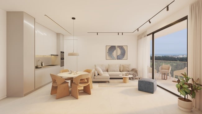 Elysia Blu 5 - Sovereign Estates Sovereign Estates Open plan living space with a beige kitchen circular dining table and four chairs a gray sofa coffee table and sliding glass doors to a balcony with a distant coastal view 2026 Open plan living space with a beige kitchen circular dining table and four chairs a gray sofa coffee table and sliding glass doors to a balcony with a distant coastal view