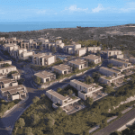 Sovereign Estates   Aerial view of a hillside coastal neighborhood of beige modern villas with winding roads and green landscaping near the sea 2026 Aerial view of a hillside coastal neighborhood of beige modern villas with winding roads and green landscaping near the sea