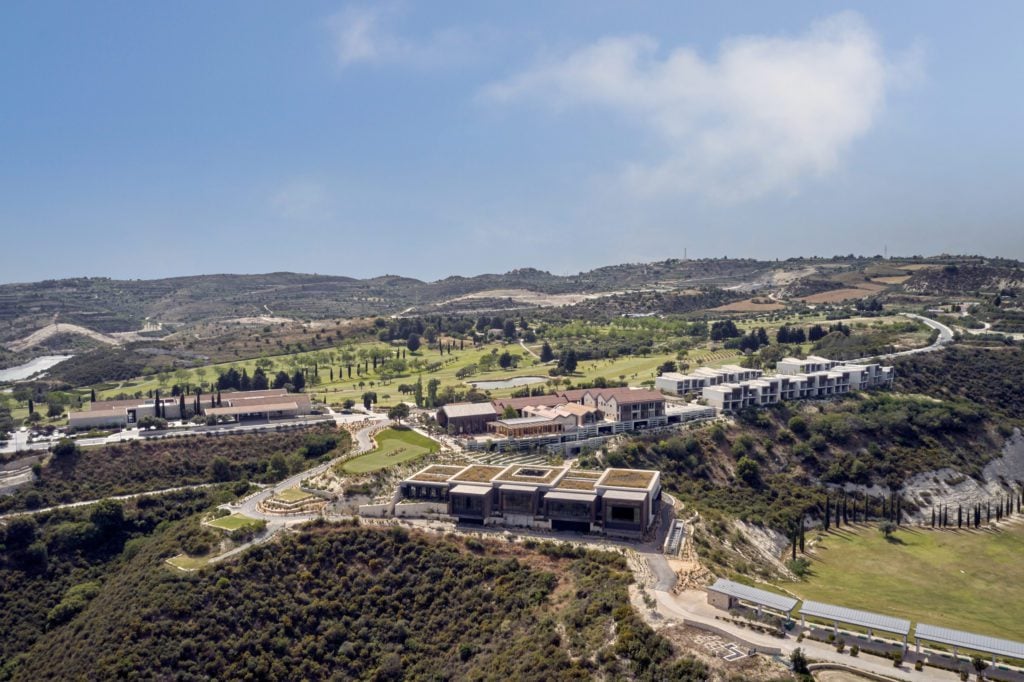 Resort-1024x682jpg - Sovereign Estates Sovereign Estates Aerial view of a hillside residential complex with modern low rise buildings landscaped lawns and winding roads while surrounded by scrubby hills 2026 Aerial view of a hillside residential complex with modern low rise buildings landscaped lawns and winding roads while surrounded by scrubby hills
