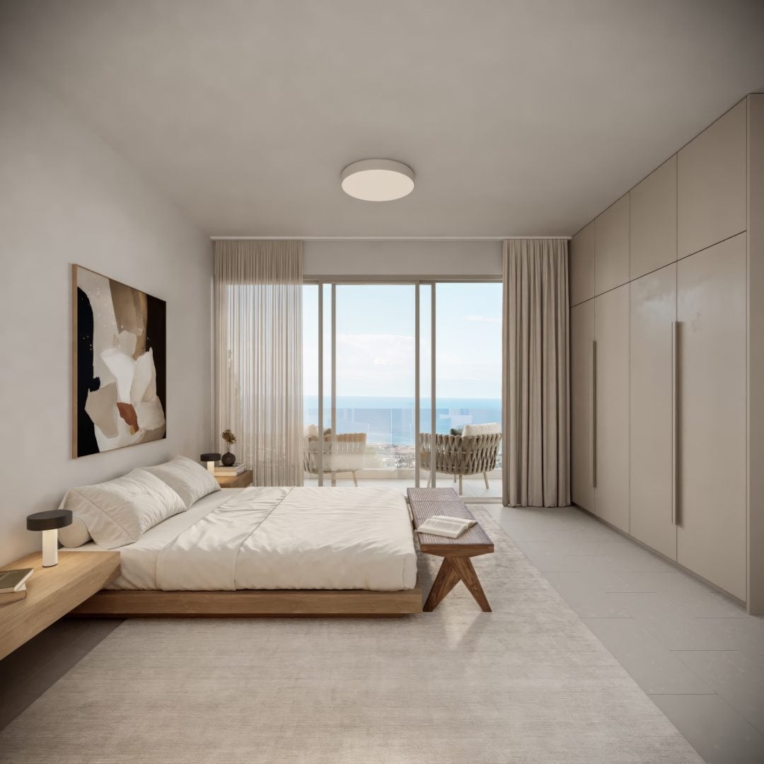 Master_bedroom_General_TA - Sovereign Estates Sovereign Estates Modern minimalist bedroom with a low wooden bed white bedding built in wardrobes and a balcony with an ocean view outside 2026 Modern minimalist bedroom with a low wooden bed white bedding built in wardrobes and a balcony with an ocean view outside