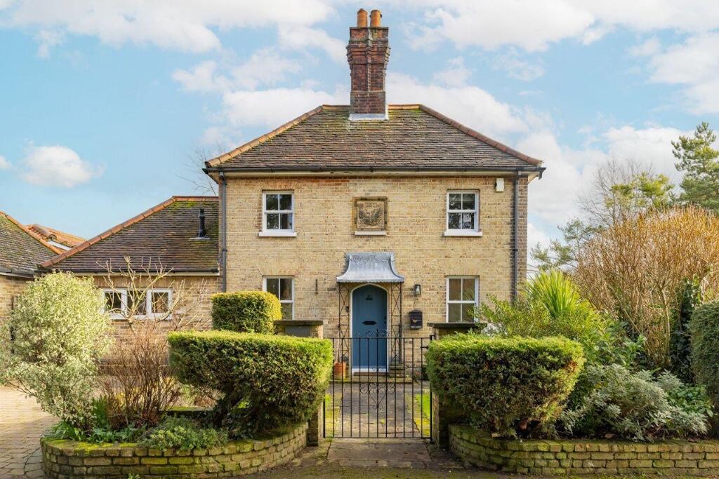 d23efb9276e7ba8d11b16ac3dd37d81d - Sovereign Estates Sovereign Estates Brick two story house with a blue front door black gate and a neatly landscaped garden 2026 Brick two story house with a blue front door black gate and a neatly landscaped garden