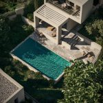 Sovereign Estates   Aerial view of a modern villa with a rectangular turquoise pool stone patio and outdoor seating area under a pergola 2026 Aerial view of a modern villa with a rectangular turquoise pool stone patio and outdoor seating area under a pergola