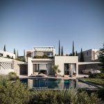 Sovereign Estates   Modern villa with a rectangular pool white stucco walls and outdoor lounge seating under a clear blue sky 2026 Modern villa with a rectangular pool white stucco walls and outdoor lounge seating under a clear blue sky