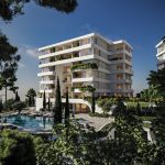 Sovereign Estates   Modern white apartment building with curved balconies lush greenery and a large outdoor pool area 2026 Modern white apartment building with curved balconies lush greenery and a large outdoor pool area