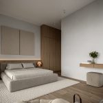 Sovereign Estates   Modern bedroom with a low beige bed padded headboard two nightstands with lamps and a large wooden wardrobe 2026 Modern bedroom with a low beige bed padded headboard two nightstands with lamps and a large wooden wardrobe