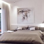Sovereign Estates   Minimalist bedroom with a low beige bed neutral pillows abstract art above the headboard and a balcony door to the left 2026 Minimalist bedroom with a low beige bed neutral pillows abstract art above the headboard and a balcony door to the left
