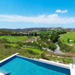 Sovereign Estates   Terraced blue swimming pool in the foreground with a lush green golf course and rolling hills under a bright blue sky in the distance 2026 Terraced blue swimming pool in the foreground with a lush green golf course and rolling hills under a bright blue sky in the distance