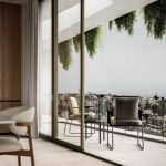 Sovereign Estates   Modern living room with floor to ceiling glass doors opening to a balcony two chairs and a small table overlook the city 2026 Modern living room with floor to ceiling glass doors opening to a balcony two chairs and a small table overlook the city