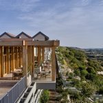 Sovereign Estates   Outdoor dining terrace of a hillside hotel with wooden beams and tables overlooking the valley 2026 Outdoor dining terrace of a hillside hotel with wooden beams and tables overlooking the valley