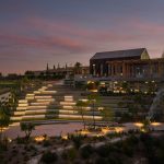 Sovereign Estates   Terraced outdoor amphitheater with illuminated steps at dusk modern wooden building in background 2026 Terraced outdoor amphitheater with illuminated steps at dusk modern wooden building in background