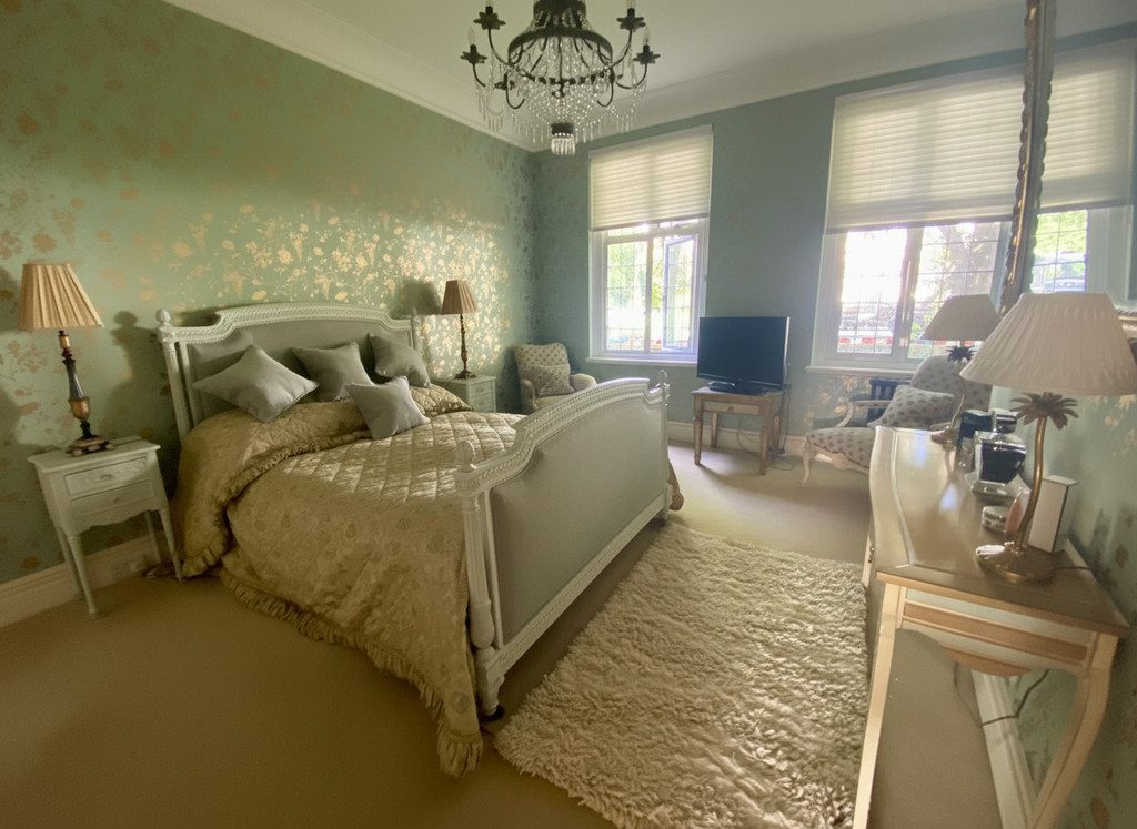 IMG_21_23_largejpg - Sovereign Estates Sovereign Estates Elegant vintage bedroom with a white carved bed soft beige bedding chandelier and a fluffy rug 2026 Elegant vintage bedroom with a white carved bed soft beige bedding chandelier and a fluffy rug