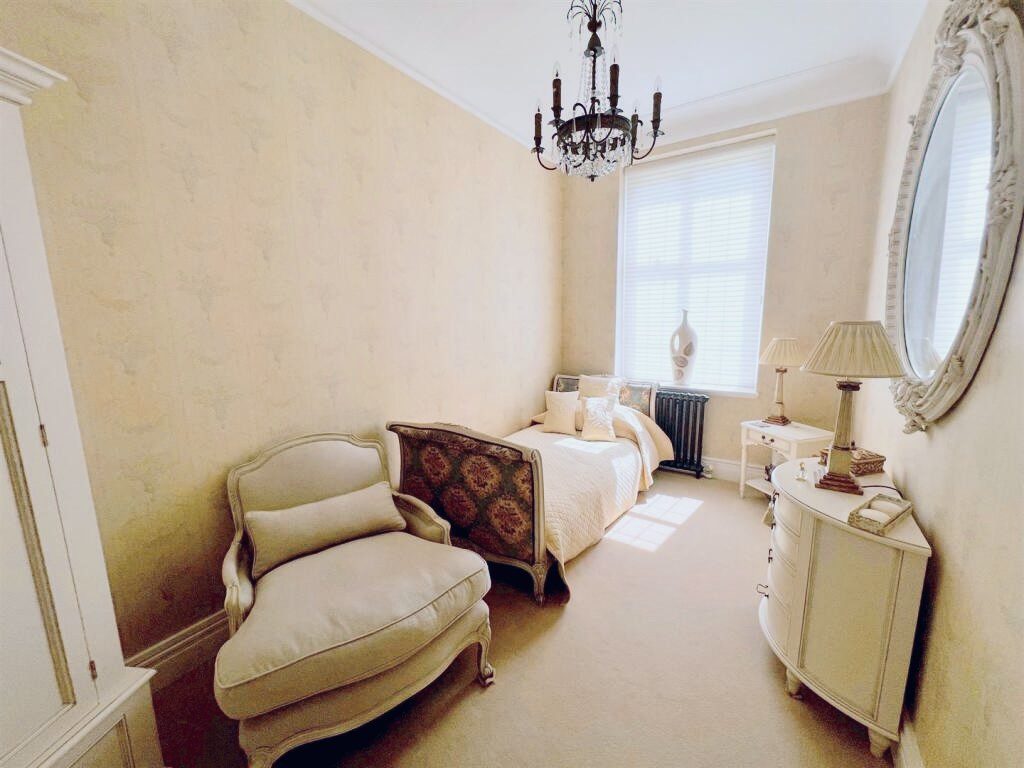 IMG_21_26_largejpg - Sovereign Estates Sovereign Estates Vintage style bedroom with a single bed chaise lounge chandelier and round ornate mirror 2026 Vintage style bedroom with a single bed chaise lounge chandelier and round ornate mirror