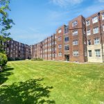 Sovereign Estates   Red brick apartment buildings surround a well kept green lawn under a bright blue sky 2026 Red brick apartment buildings surround a well kept green lawn under a bright blue sky