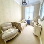 Sovereign Estates   Cozy vintage bedroom with cream furniture a daybed chaise chandelier and a large oval mirror 2026 Cozy vintage bedroom with cream furniture a daybed chaise chandelier and a large oval mirror