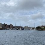 Sovereign Estates   Marina with numerous sailboats docked along a canal brick townhouses on the left and low buildings on the right under a cloudy sky 2026 Marina with numerous sailboats docked along a canal brick townhouses on the left and low buildings on the right under a cloudy sky