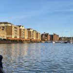 Sovereign Estates   Waterfront view of brick apartment buildings along a river with moored sailboats and a clear blue sky 2026 Waterfront view of brick apartment buildings along a river with moored sailboats and a clear blue sky