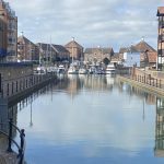 IMG_23_1_largejpg - Sovereign Estates Sovereign Estates Calm canal with boats docked at a marina brick buildings lining both sides and reflections in the water 2026 Calm canal with boats docked at a marina brick buildings lining both sides and reflections in the water