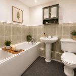 IMG_23_84_largejpg - Sovereign Estates Sovereign Estates A white bathtub with a wooden bath tray holding a candle small plant and a folded towel against tiled walls in a tidy bathroom 2026 A white bathtub with a wooden bath tray holding a candle small plant and a folded towel against tiled walls in a tidy bathroom