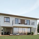 Sovereign Estates   Modern two story house with a balcony large glass sliding doors and a stone clad lower level set on a green lawn 2026 Modern two story house with a balcony large glass sliding doors and a stone clad lower level set on a green lawn