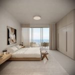 Sovereign Estates   Modern hotel bedroom with a low wooden platform bed white bedding and neutral tones facing a balcony with an ocean view 2026 Modern hotel bedroom with a low wooden platform bed white bedding and neutral tones facing a balcony with an ocean view