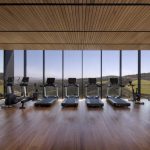 Sovereign Estates   Gym with a row of treadmills facing large windows overlooking hills and valleys wooden floor and ceiling panels visible 2026 Gym with a row of treadmills facing large windows overlooking hills and valleys wooden floor and ceiling panels visible