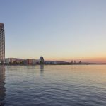 Sovereign Estates   Sunset over a coastal city with tall modern buildings along the shore and calm water reflecting the sky 2026 Sunset over a coastal city with tall modern buildings along the shore and calm water reflecting the sky