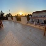 Sovereign Estates   Sunset view from a tiled rooftop terrace with a red railing and a few chairs on the left 2026 Sunset view from a tiled rooftop terrace with a red railing and a few chairs on the left