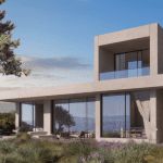 Sovereign Estates   Modern two story house with floor to ceiling glass walls and a spacious patio overlooking a coastal landscape with purple flowers in the foreground 2026 Modern two story house with floor to ceiling glass walls and a spacious patio overlooking a coastal landscape with purple flowers in the foreground