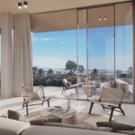 Sovereign Estates   Open plan living room with floor to ceiling glass doors opening to a sunny patio and expansive landscape beyond 2026 Open plan living room with floor to ceiling glass doors opening to a sunny patio and expansive landscape beyond