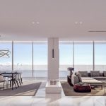 Sovereign Estates   Open plan living and dining room with floor to ceiling ocean view windows modern chandelier and neutral furniture 2026 Open plan living and dining room with floor to ceiling ocean view windows modern chandelier and neutral furniture
