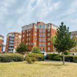 Sovereign Estates   Brick apartment buildings forming a courtyard with trimmed bushes trees and a clear sky above 2026 Brick apartment buildings forming a courtyard with trimmed bushes trees and a clear sky above
