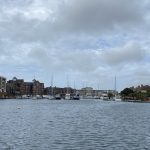 IMG_25_19_largejpg - Sovereign Estates Sovereign Estates A marina with moored boats and sailboats along a calm waterway brick buildings lining the shore under a cloudy sky 2026 A marina with moored boats and sailboats along a calm waterway brick buildings lining the shore under a cloudy sky