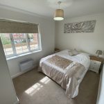 IMG_25_38_largejpg - Sovereign Estates Sovereign Estates Small double bedroom with beige and white bedding two white nightstands and a window letting in daylight 2026 Small double bedroom with beige and white bedding two white nightstands and a window letting in daylight