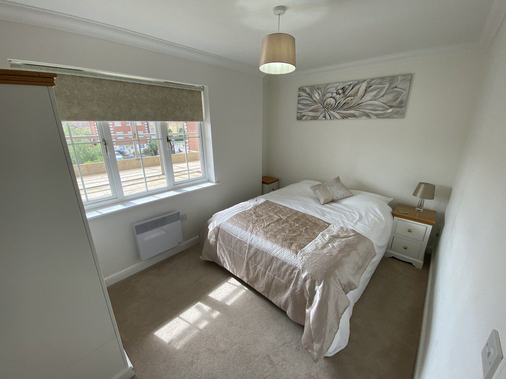 IMG_25_38_largejpg - Sovereign Estates Sovereign Estates Small double bedroom with beige and white bedding two white nightstands and a window letting in daylight 2026 Small double bedroom with beige and white bedding two white nightstands and a window letting in daylight